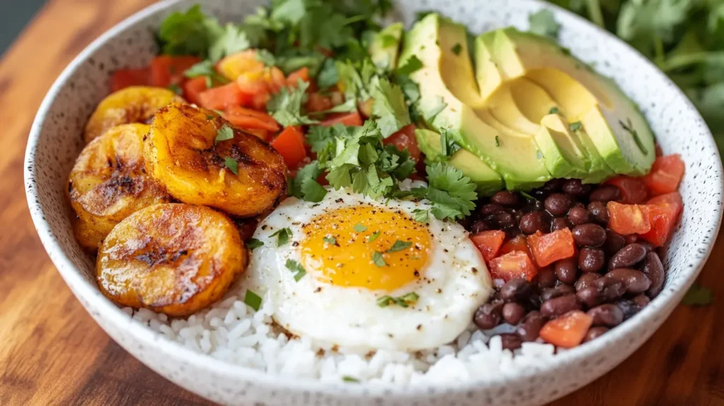 Vegan Cuban breakfast bowl with rice, beans, and plantains.